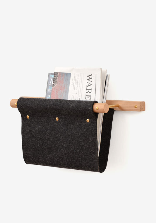 Wall mounted magazine rack and mail holder made from oak, brass and black felt.