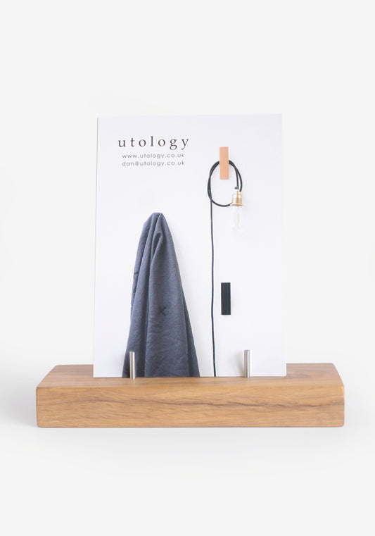 Wooden postcard stand made from solid oak with four stainless steel pins to hold postcards.